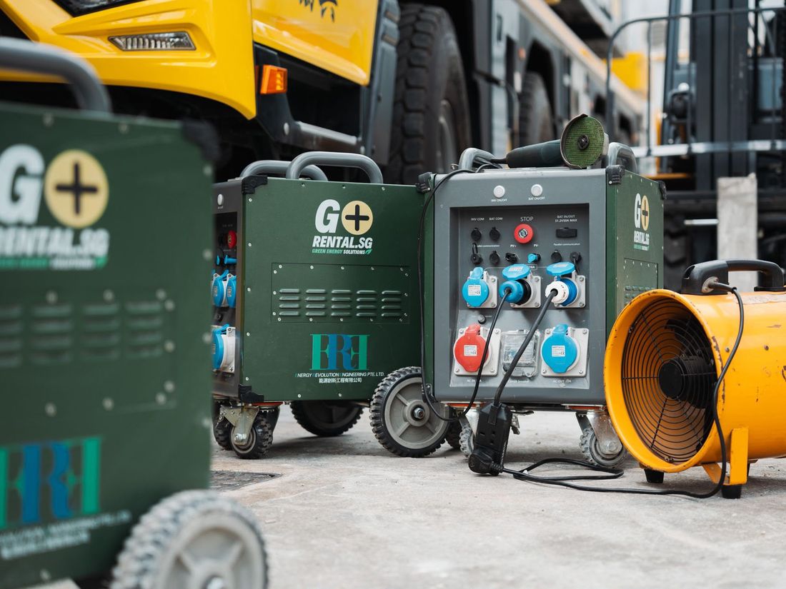 Mobile battery generator powering civil road works and jet washing equipment