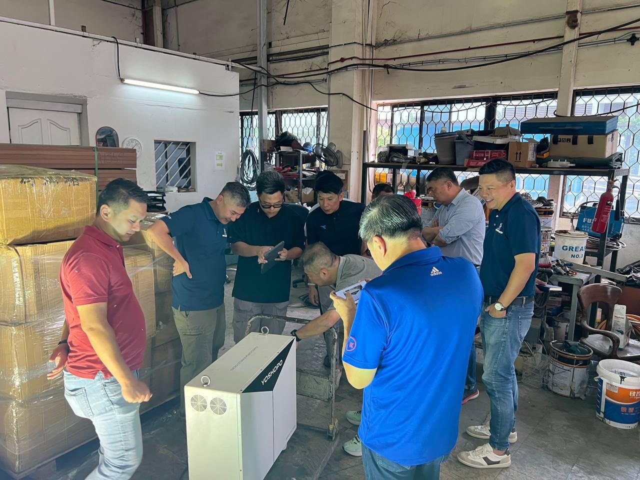 The Energy Revolution Engineering team working on a battery energy storage system in the workshop